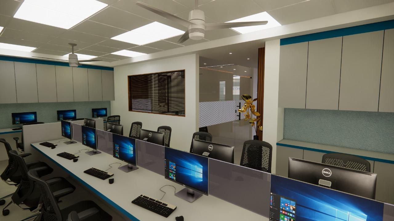 Open-plan office workspace with workstations and glass partition